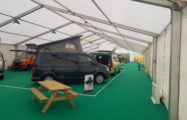 Setting up the campervan display inside the marquee
