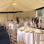 Wedding Marquee with glazing, tables, chairs, lighting, flowers and dance floor