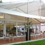 Wedding Marquee in a country house setting with clear gables and panoramic window walls