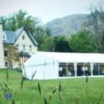 Wedding marquee at Glenfinnan Hotel with clear panoramic window walls