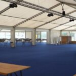 Carpeted marquee used for hosting a large public event