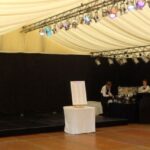 Marquee decorated for a party setting with drinks bar