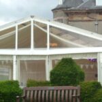 Marquee with a clear gable and panoramic window walls at Finlaystone House