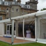 Wedding Marquee in a country house setting with clear gables