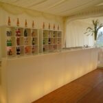 Marquee decorated for a party setting with drinks bar