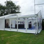 Marquee with PVC window walls with a branded gable
