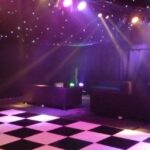 Wedding Marquee with black star cloth ceiling and event lighting