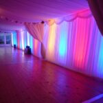 Marquee Lighting examples - coloured LED uplighters on walls