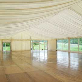 Floored marquee fully lined with panoramic window walls