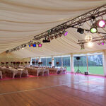 Entertainment lighting over a wedding marquee dancefloor