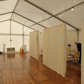 Covid vacination clinic with partitioned cubicals and LED lighting