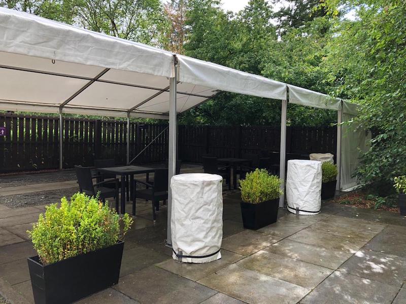 Benmore Gardens outdoor cafe canopy cover marquee with covered water ballast barrels