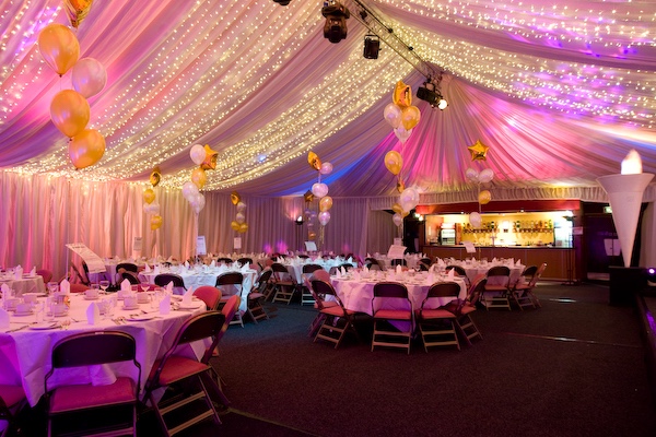 Queens Hall Dunoon marquee with pea lamp roof canopy, event lighting, bar and dining tables.
