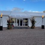 Stunning winter wedding marquee with a flambeaux entrance.