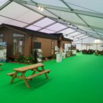 LED floodlights and green carpet in the marquee hosting a chalet for the caravan/camping exhibition at the SEC Campus Glasgow