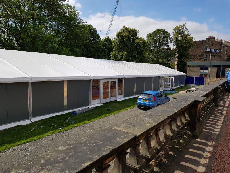 Temporary kitchen marquee with weather protection and access doors for use whilst a building restoration was taking place.