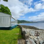 Solid glazing in a shoreside wedding marquee in Argyll