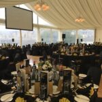 Globe chandeliers and panoramic window walls in an award ceremony marquee at Kip Marina, Inverclyde