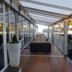 Covered verandah area with additional seating for a corporate event