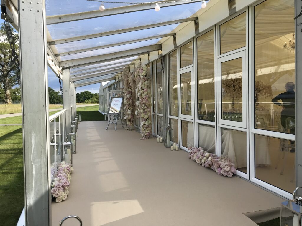 Carpeted verandah area on a wedding marquee at Loch Lomond